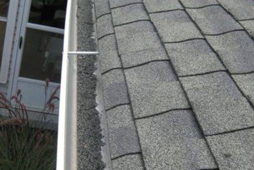 damaged gutter roof repair and repalcement with dirt in gutters