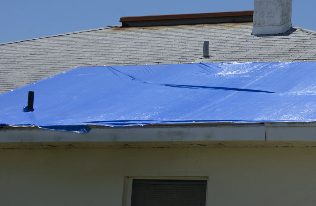 emergency tarp on roof during replacement