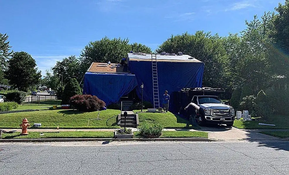 home tarped during roofing remodel