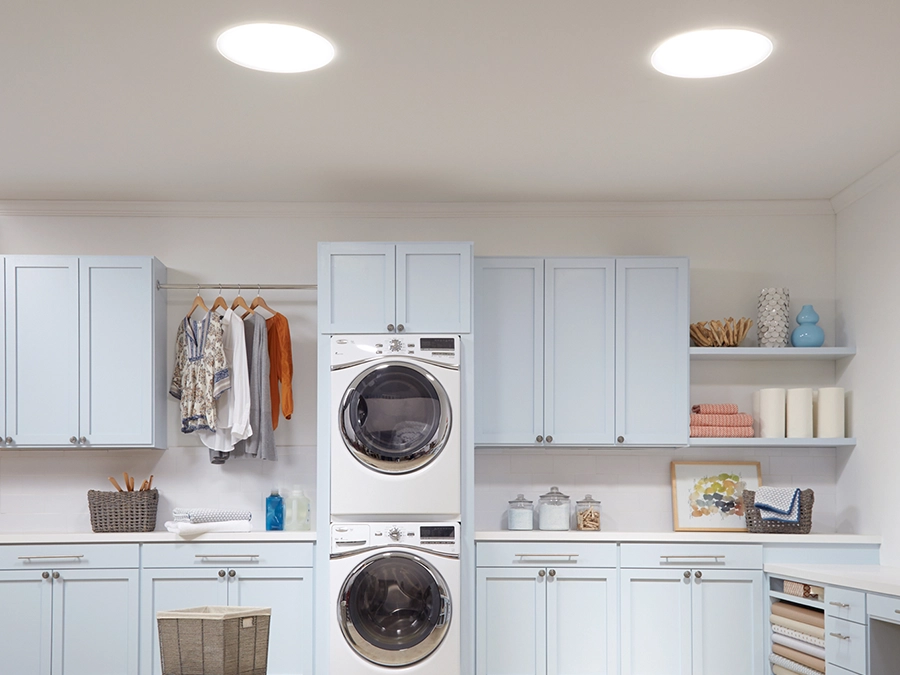 Laundry room with sun tunnels.