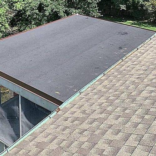 Trusted Flat Roof Repair Contractor in Maryland House with an attached flat roof